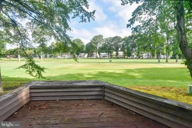 a kitchen with a refrigerator and a stove top oven