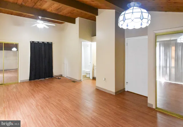 a bathroom with a sink a toilet and a large mirror
