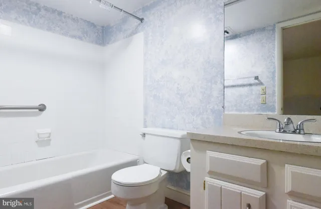 a view of a room with wooden floor and outdoor space