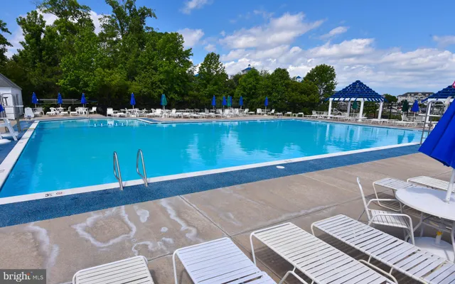 a front view of house with yard and outdoor seating