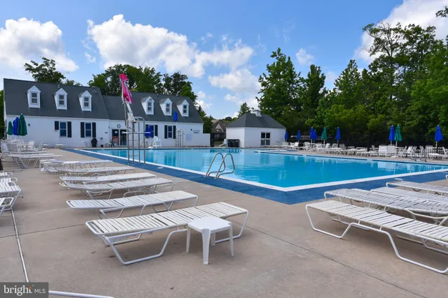 a view of a patio with swimming pool table and chairs