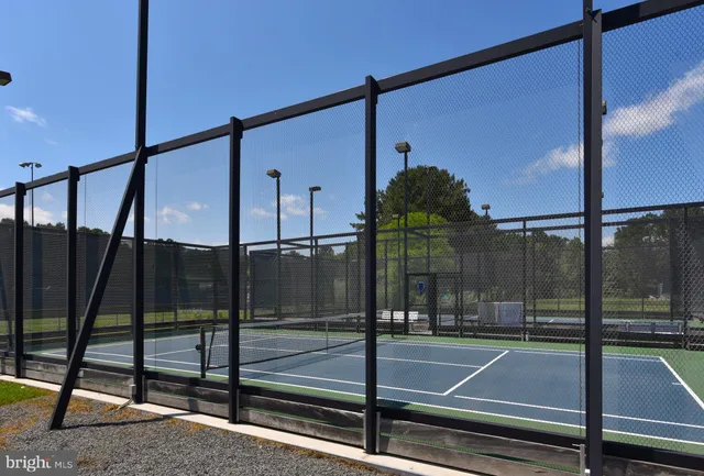 a view of a balcony with a yard