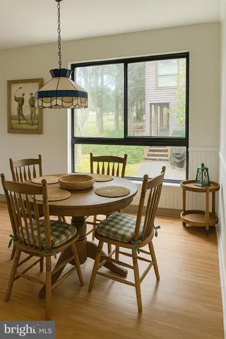 a view of a dining room with furniture window and outside view