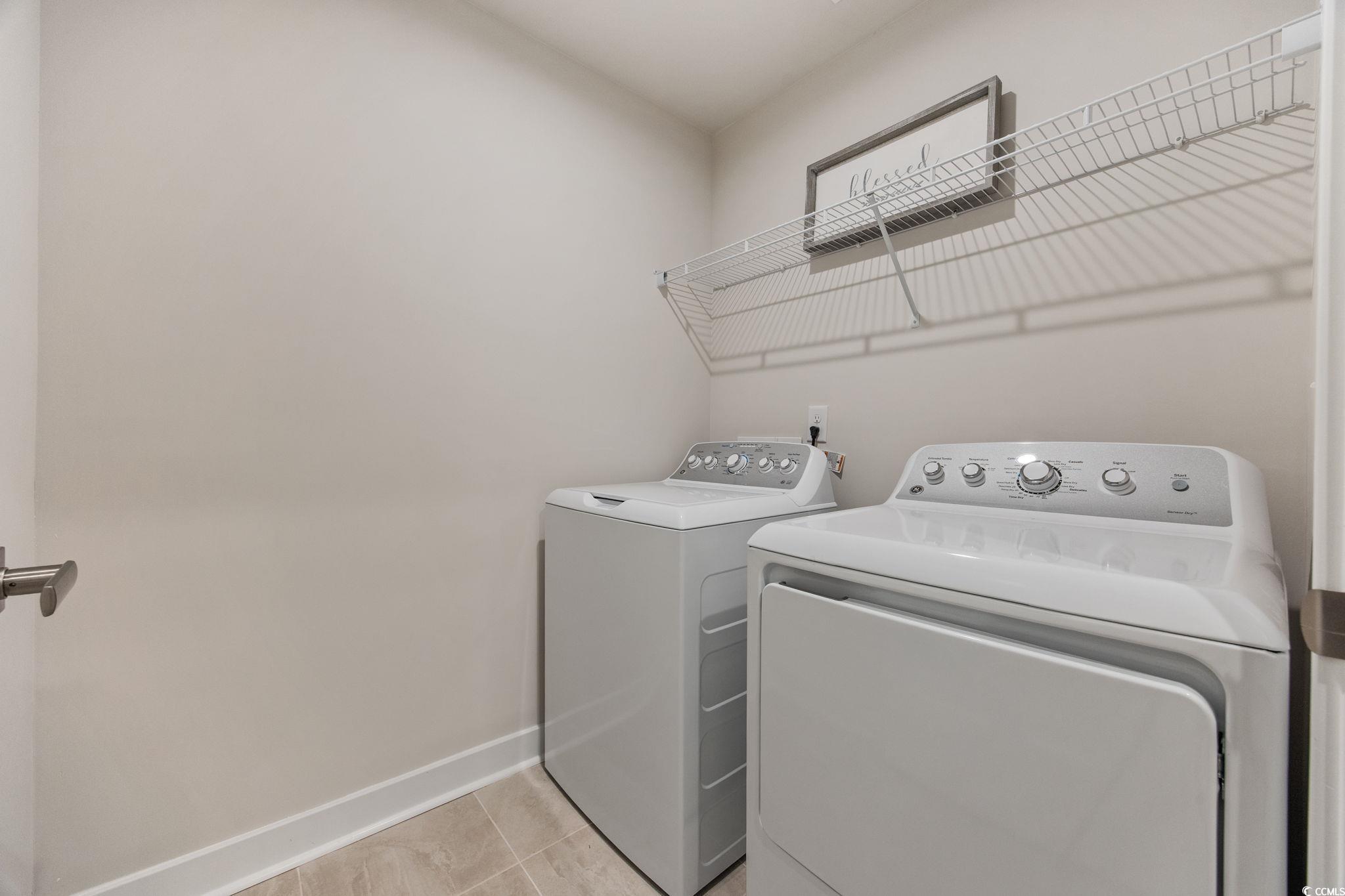 345 Bent Green, Unit 90A Murrells Inlet, SC 29576 - Photo 14 of 39 Laundry room with light tile patterned floors and washing machine and dryer