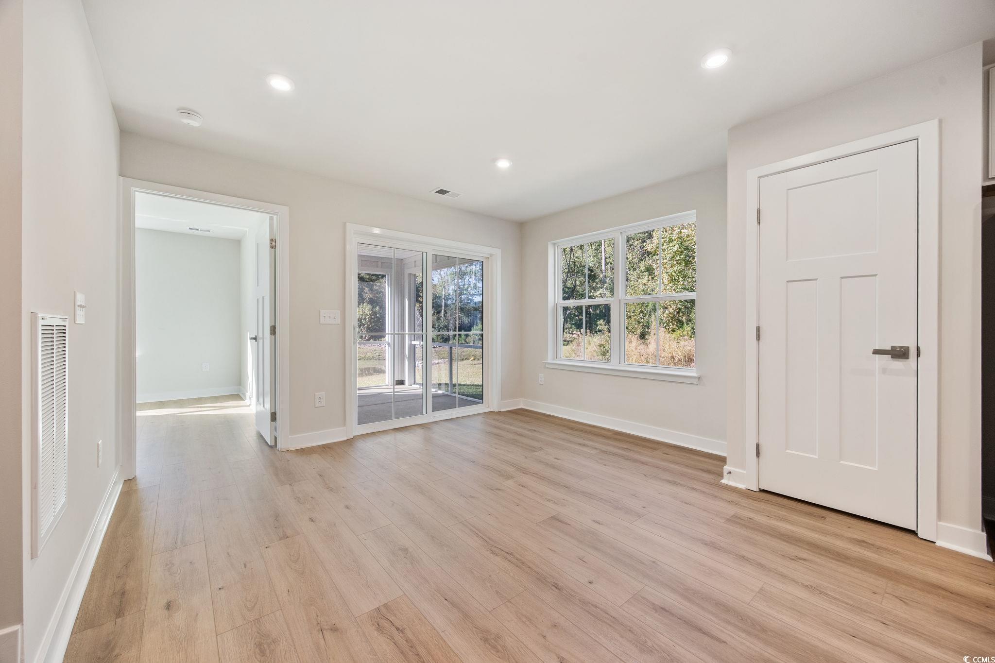 345 Bent Green, Unit 90A Murrells Inlet, SC 29576 - Photo 15 of 39 Unfurnished living room with light wood-style floors and recessed lighting