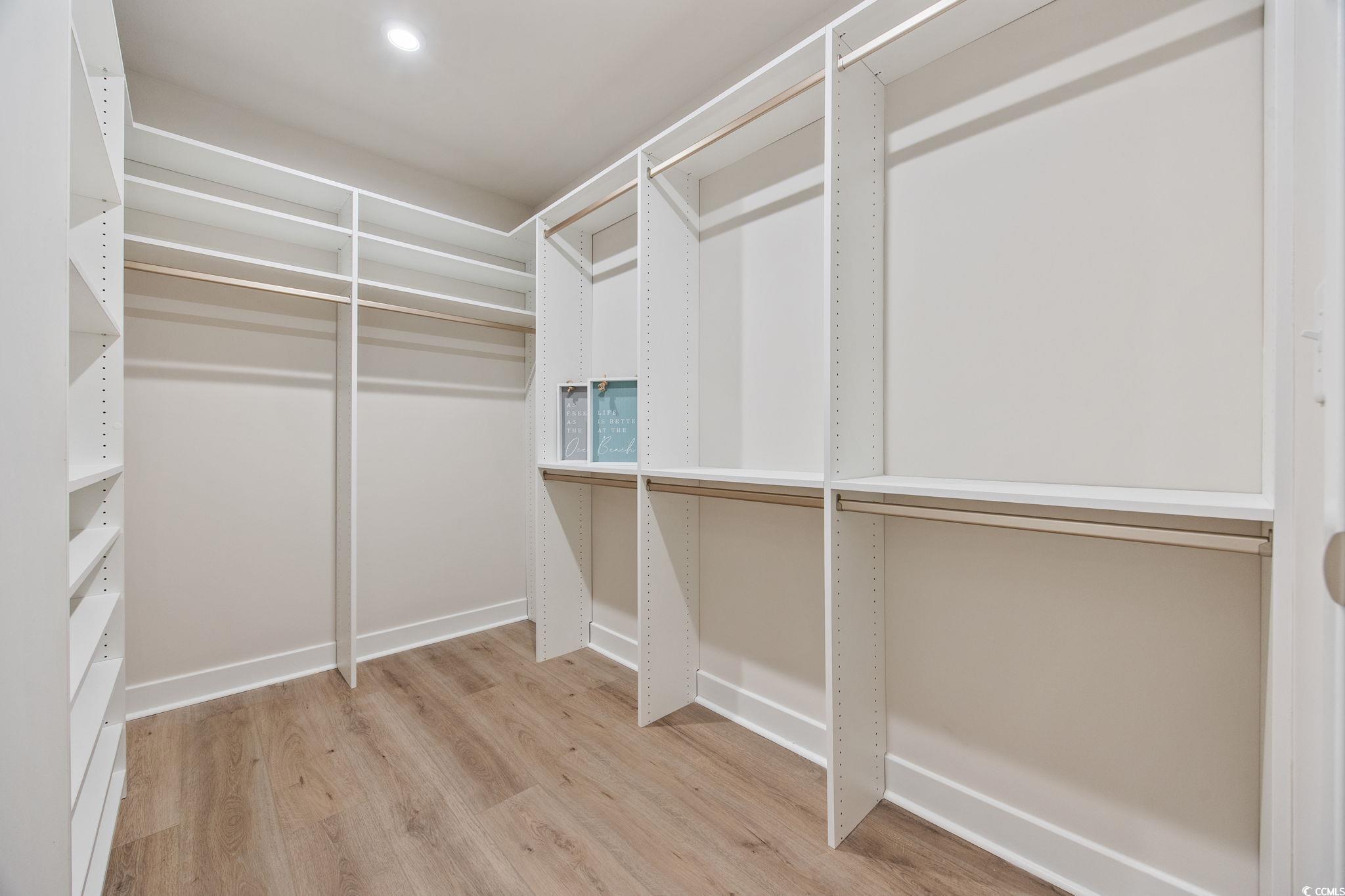 345 Bent Green, Unit 90A Murrells Inlet, SC 29576 - Photo 20 of 39 Spacious closet featuring light wood finished floors