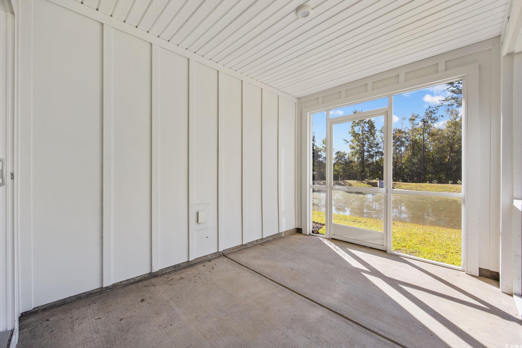 345 Bent Green, Unit 90A Murrells Inlet, SC 29576 - Photo 32 of 39 Unfurnished sunroom with a water view
