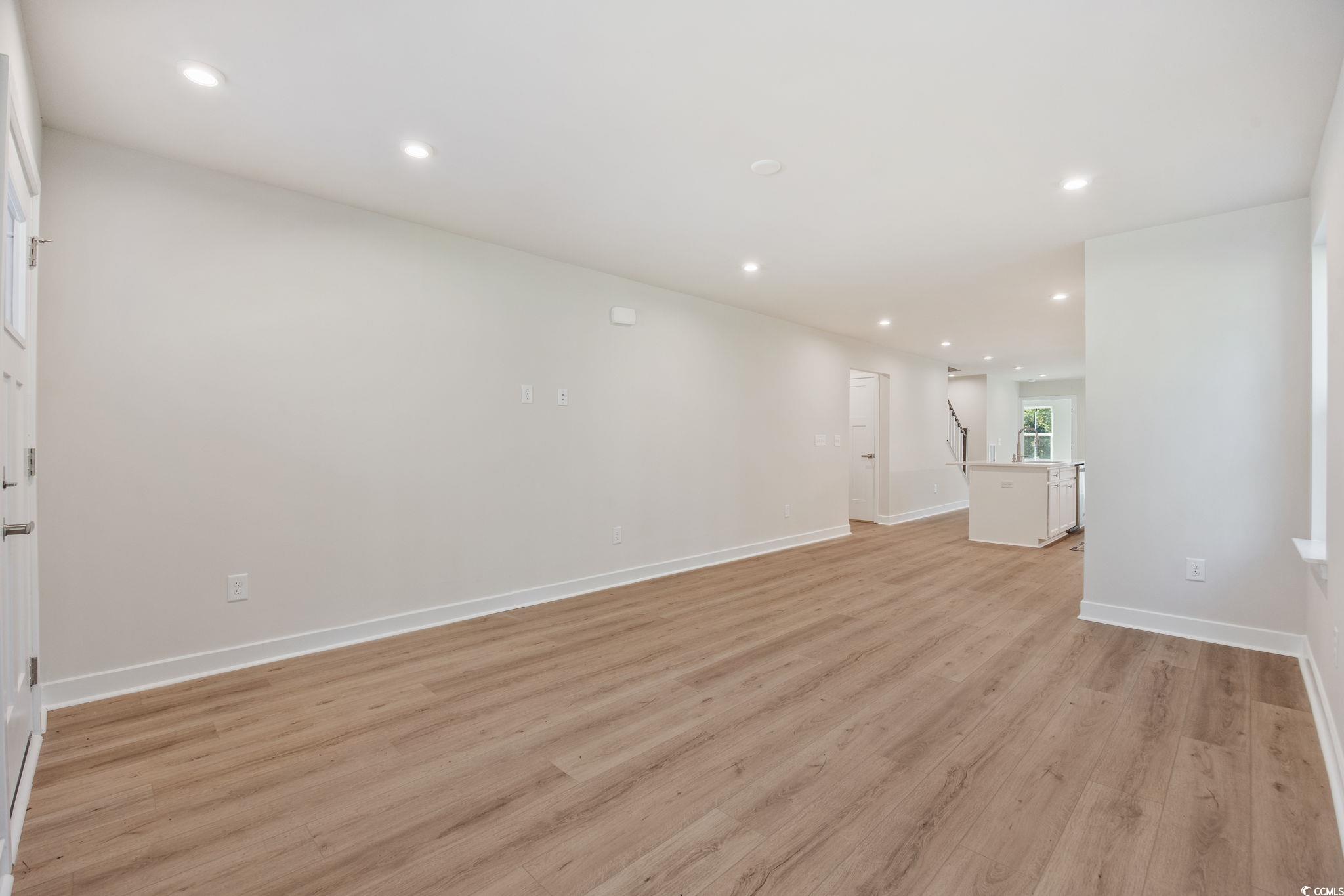 345 Bent Green, Unit 90A Murrells Inlet, SC 29576 - Photo 5 of 39 Unfurnished room featuring recessed lighting and light wood-type flooring