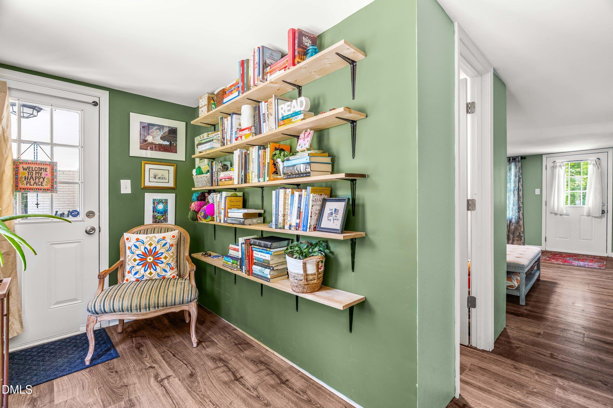 3724 Randell Road Garner, NC 27529 - Photo 19 of 32 a living room with furniture and a book shelf