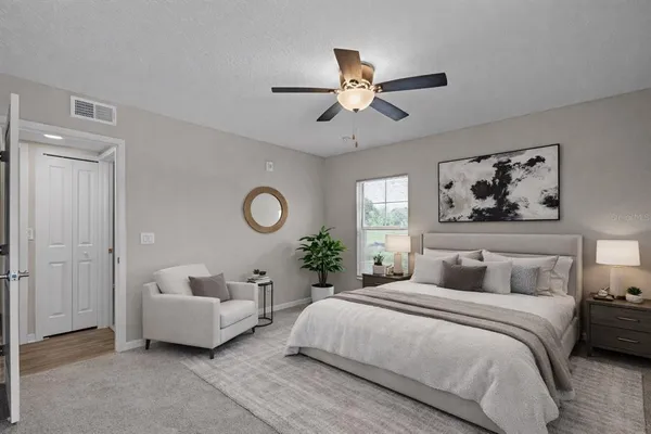 a bedroom with bed and window