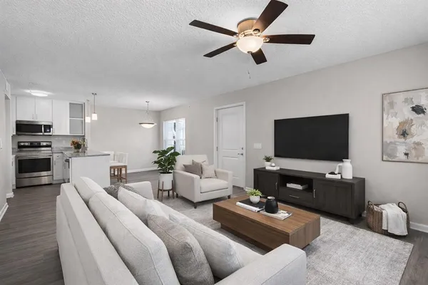 a living room with furniture and a flat screen tv