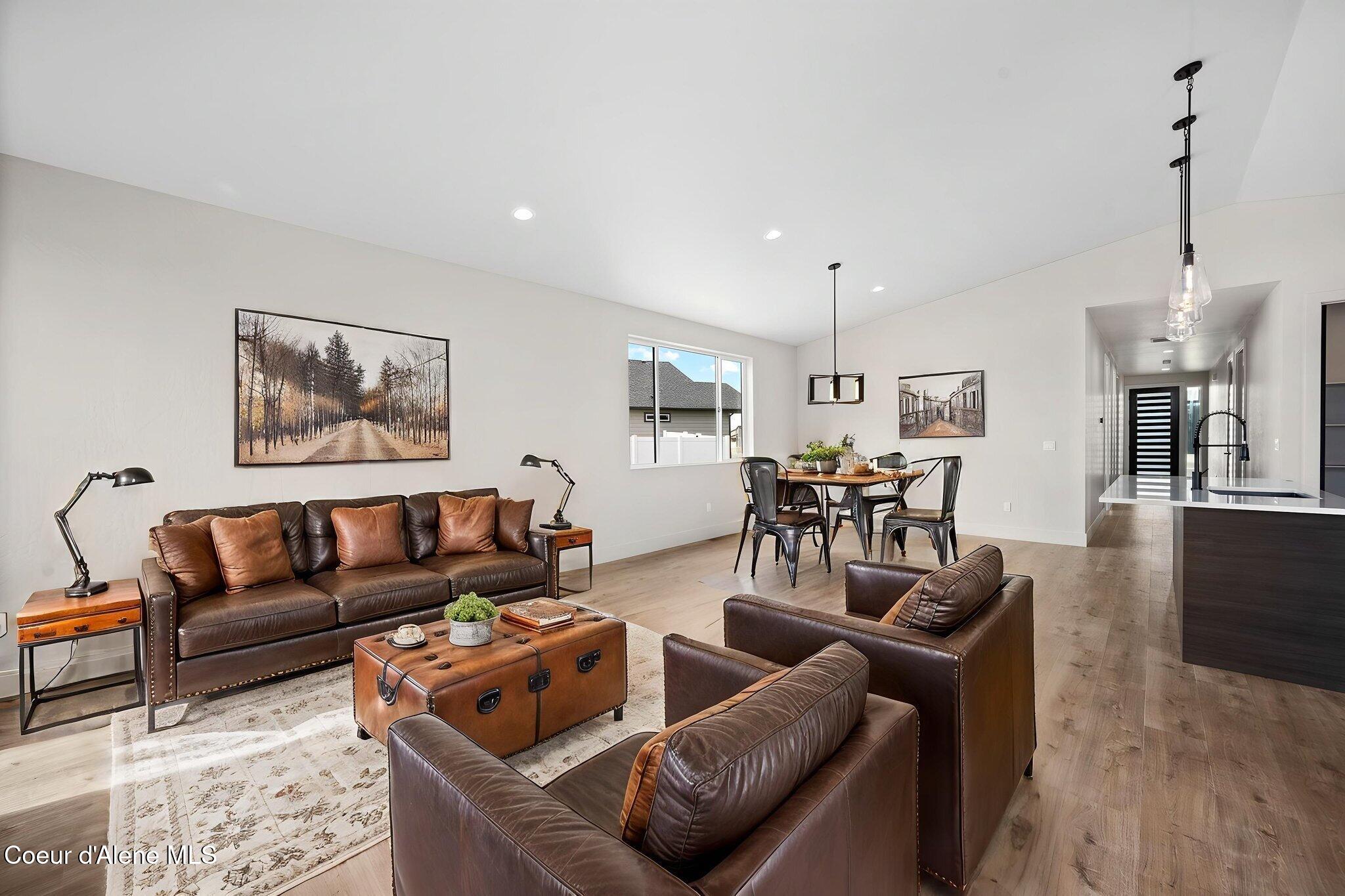 6414 West Frehley Way Rathdrum, ID 83858 - Photo 32 of 48 Great Room & Hallway Virtually Staged