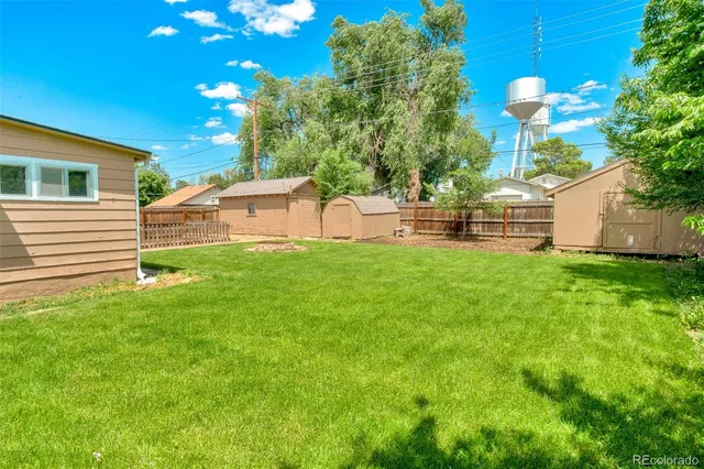 a view of a house with a backyard porch and sitting area