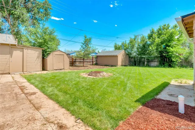 a view of a house with a yard porch and sitting area