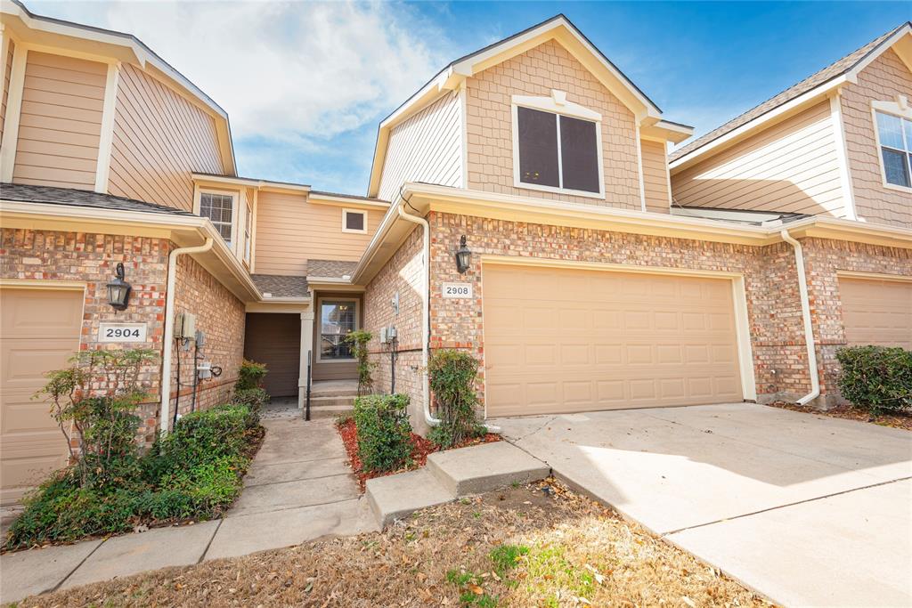 a front view of a house with a garage