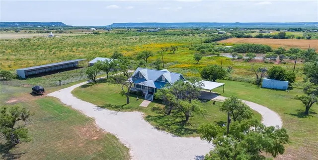 a view of a garden with a lake