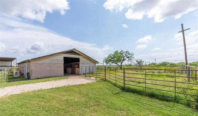 a backyard of a house with lots of green space
