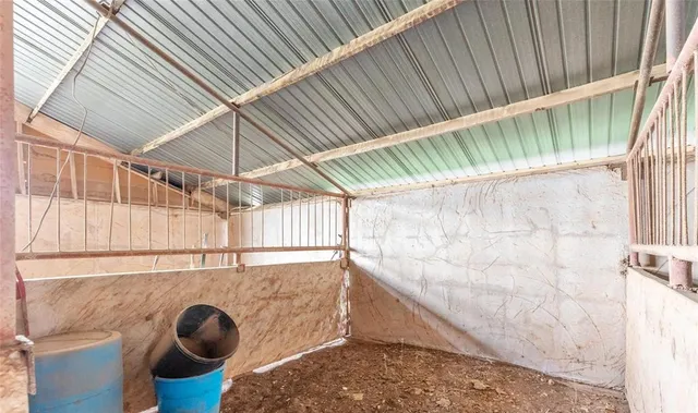 a view of porch with wooden stairs