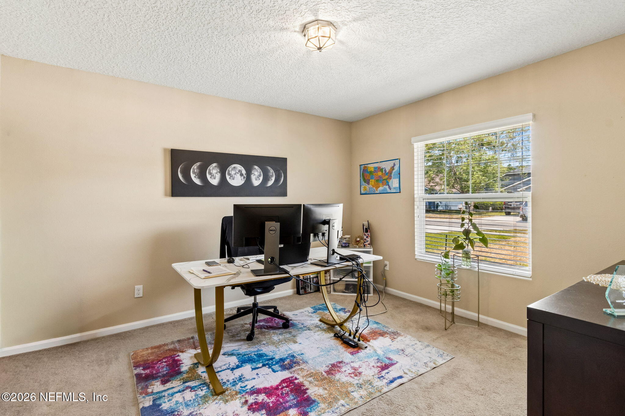 96034 Bass Lane Yulee, FL 32097 - Photo 25 of 50 a work room with furniture and a window