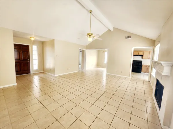 a view of an empty room and a window