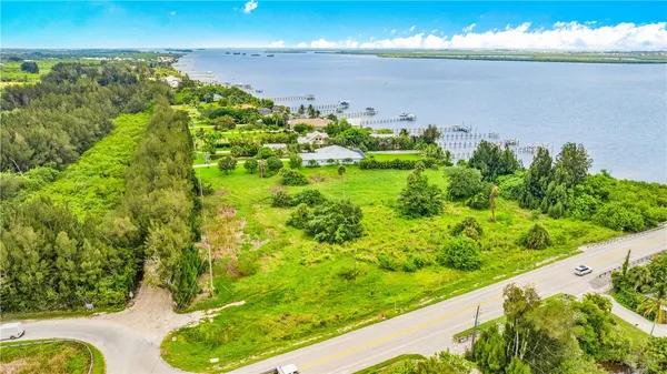 a view of a garden with an ocean view