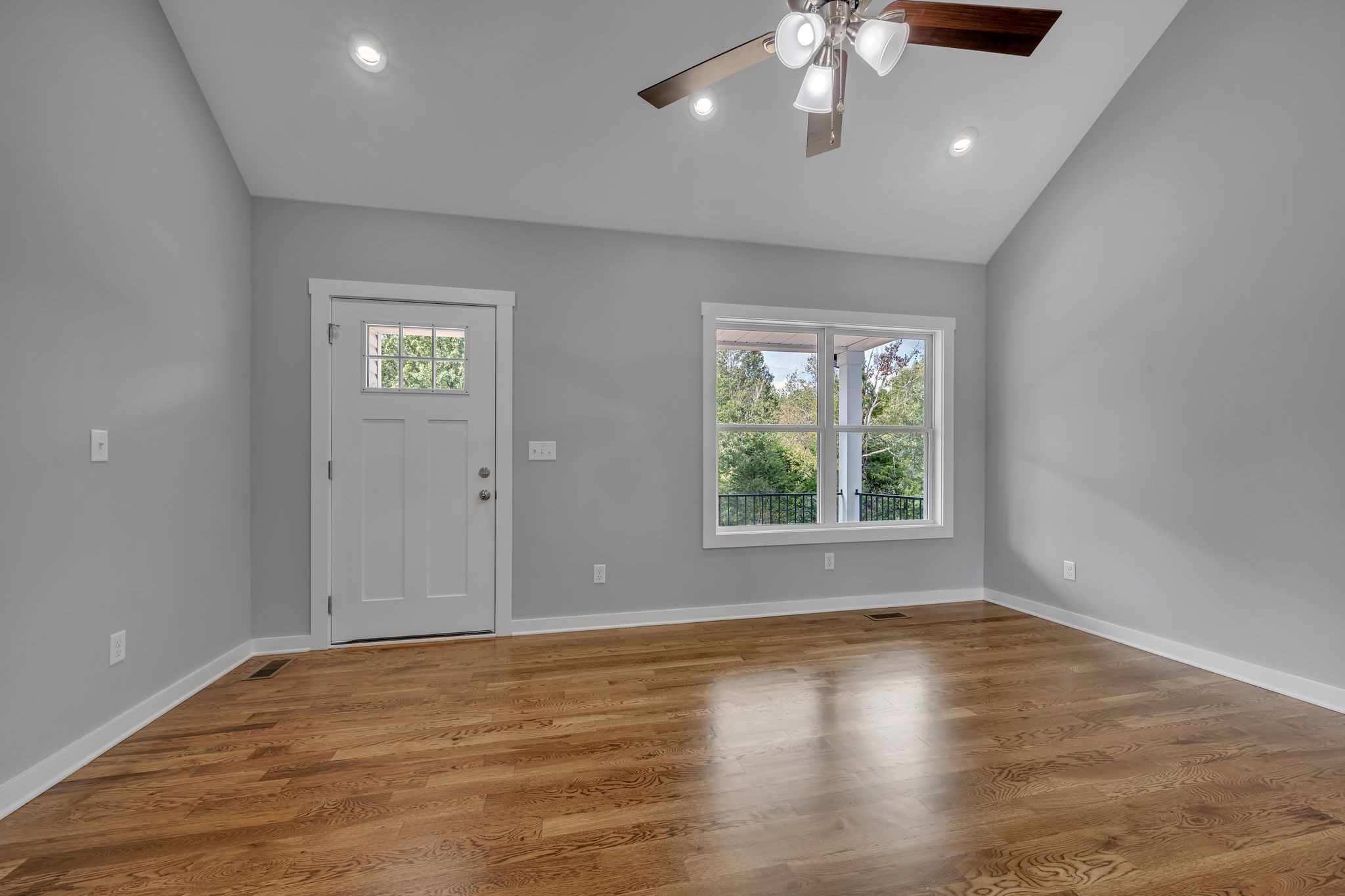 820 Jason Chapel Road Dickson, TN 37055 - Photo 5 of 26 an empty room with wooden floor chandelier and windows