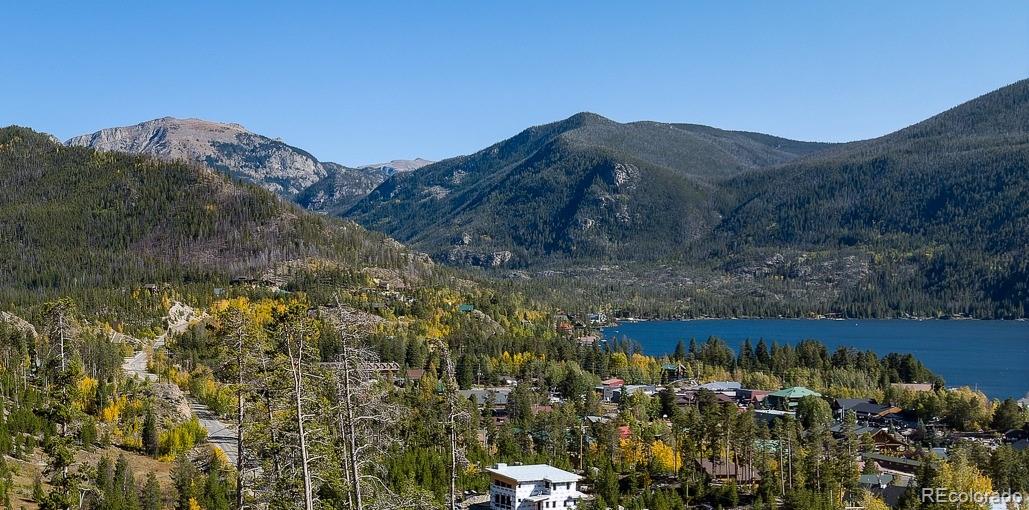 932 Old Tonahutu Ridge Road Grand Lake, CO 80447 - Photo 30 of 34 a view of a house with a mountain and a forest
