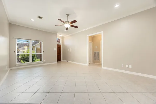 a view of an empty room with a window