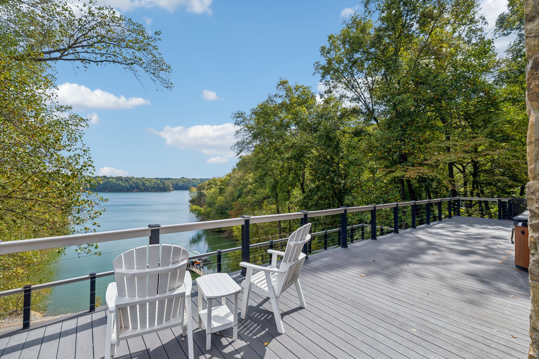 1657 Boswell Road Winchester, TN 37398 - Photo 61 of 70 a view of a roof deck with table and chairs with wooden floor and fence