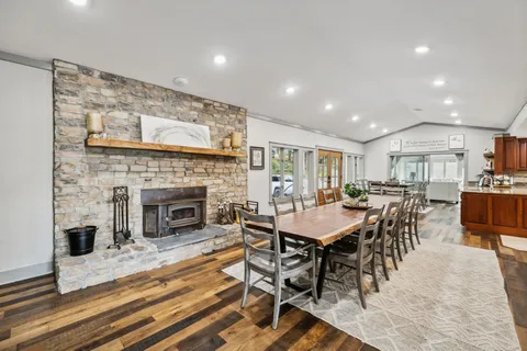 a kitchen with stainless steel appliances granite countertop wooden cabinets a sink and a stove