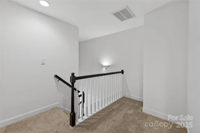 a view of a hallway with staircase