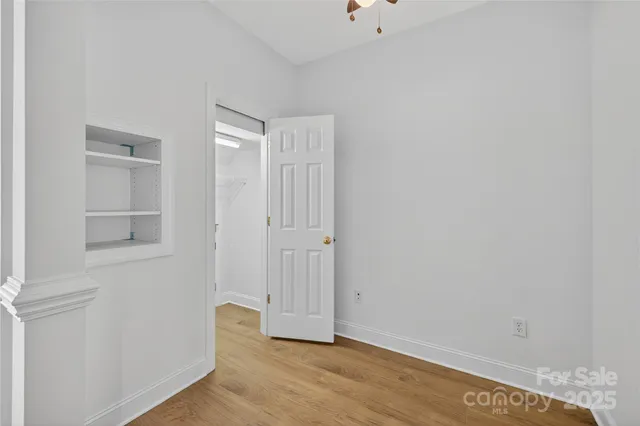 a view of room with window and hardwood floor