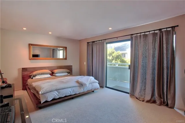 a view of a patio with table and chairs