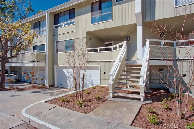 a view of building with car parked