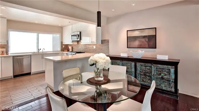 a dining room with furniture and window