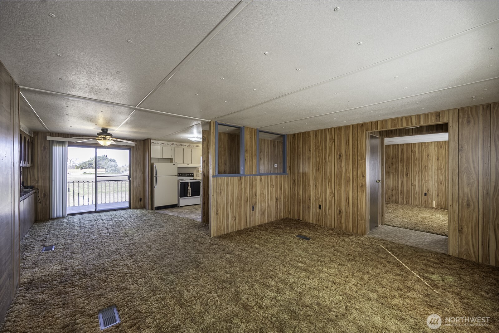 4934 Rd M Northeast Moses Lake, WA 98837 - Photo 13 of 34 an empty room with windows and cabinet
