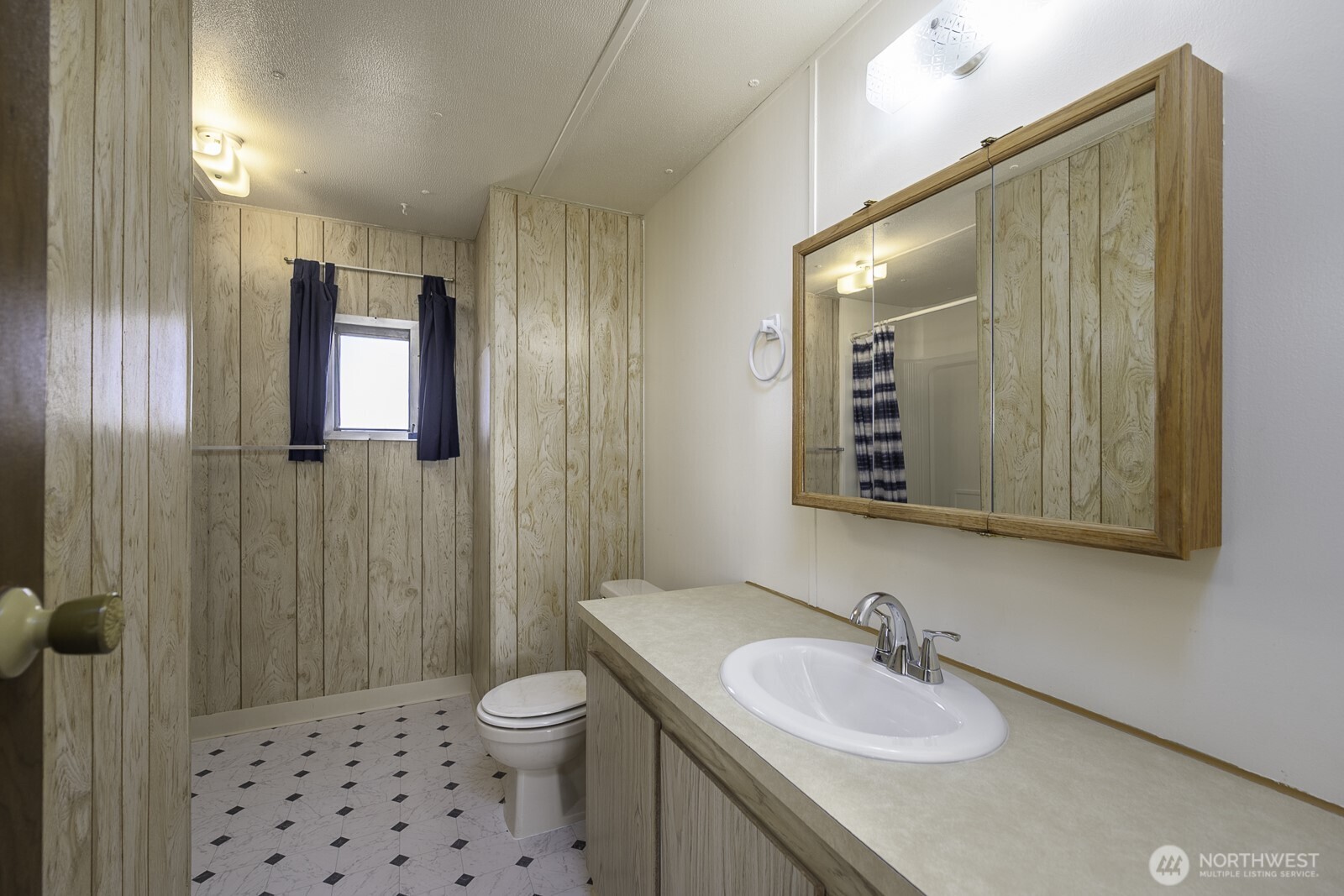 4934 Rd M Northeast Moses Lake, WA 98837 - Photo 22 of 34 a bathroom with a toilet a sink and mirror