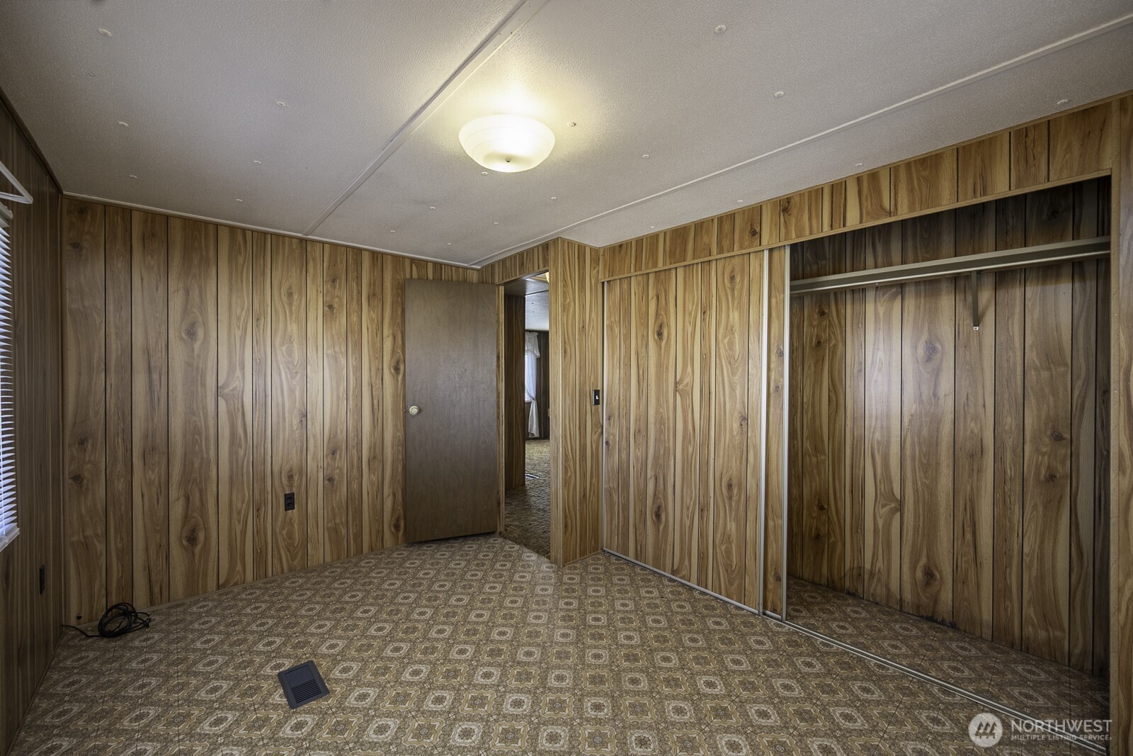 4934 Rd M Northeast Moses Lake, WA 98837 - Photo 24 of 34 a view of an empty room with wooden walls