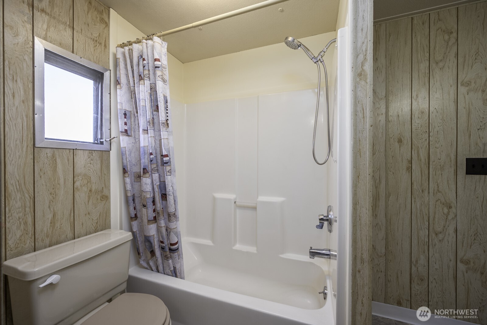 4934 Rd M Northeast Moses Lake, WA 98837 - Photo 26 of 34 a bathroom with a shower curtain and a window