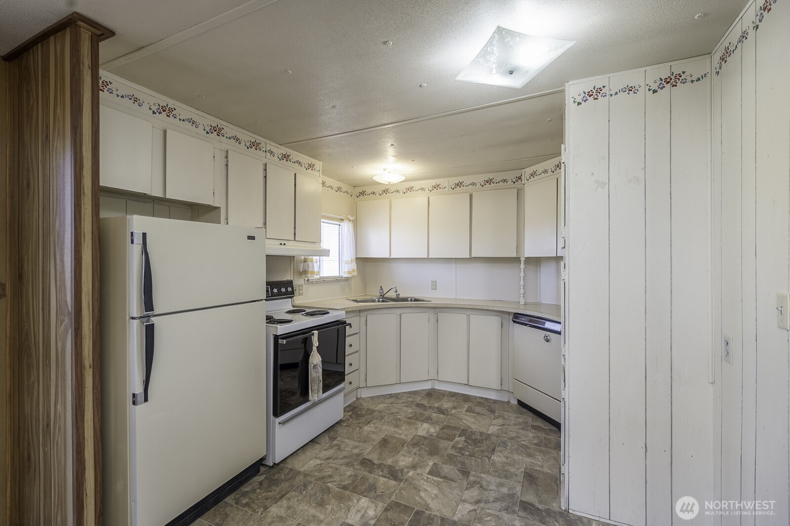 4934 Rd M Northeast Moses Lake, WA 98837 - Photo 30 of 34 a kitchen with cabinets and white stainless steel appliances
