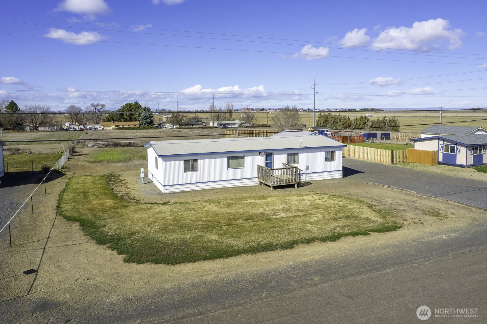 4934 Rd M Northeast Moses Lake, WA 98837 - Photo 3 of 34 a view of a swimming pool with an ocean view