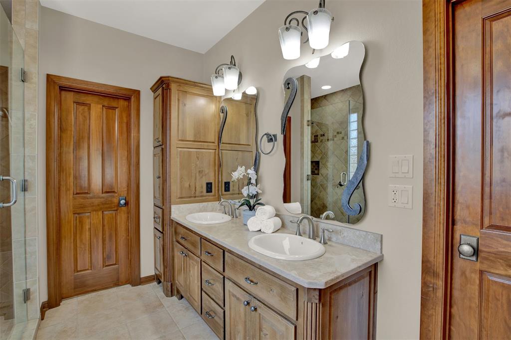 5255 Lookout Ridge Drive Marble Falls, TX 78654 - Photo 13 of 40 Master bath double vanity; right door to large walk-in closet