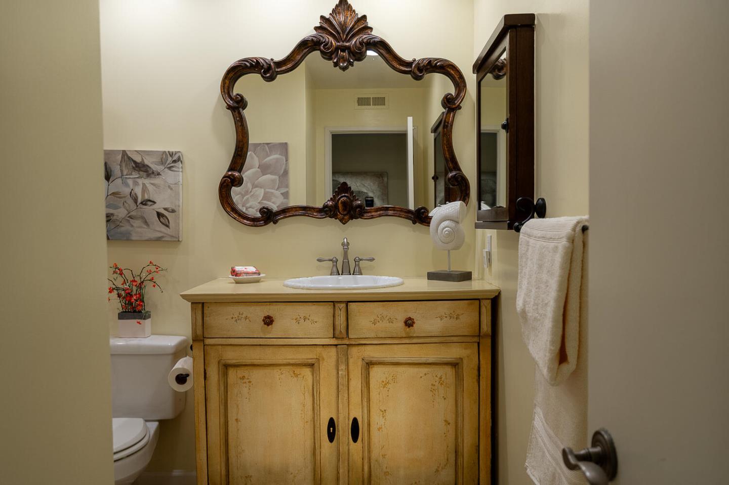 137 Peter Coutts Circle Stanford, CA 94305 - Photo 15 of 28 a bathroom with a toilet sink and mirror