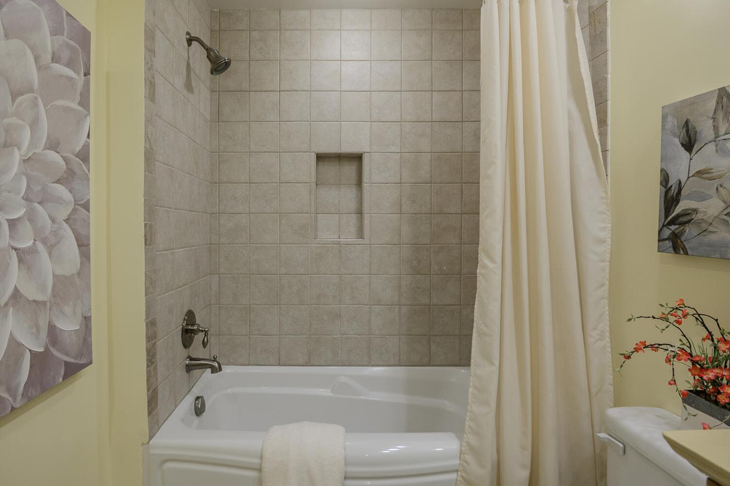 137 Peter Coutts Circle Stanford, CA 94305 - Photo 16 of 28 a bathroom with a bathtub and a shower
