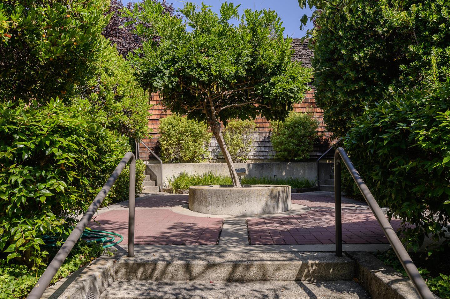 137 Peter Coutts Circle Stanford, CA 94305 - Photo 24 of 28 a view of a chair and tables in the patio