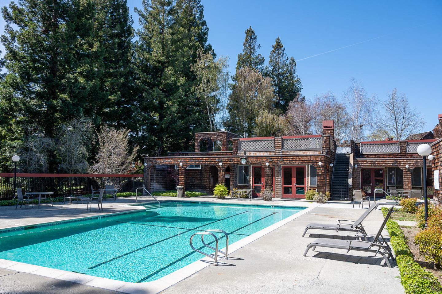137 Peter Coutts Circle Stanford, CA 94305 - Photo 27 of 28 a view of a swimming pool with a patio and a yard