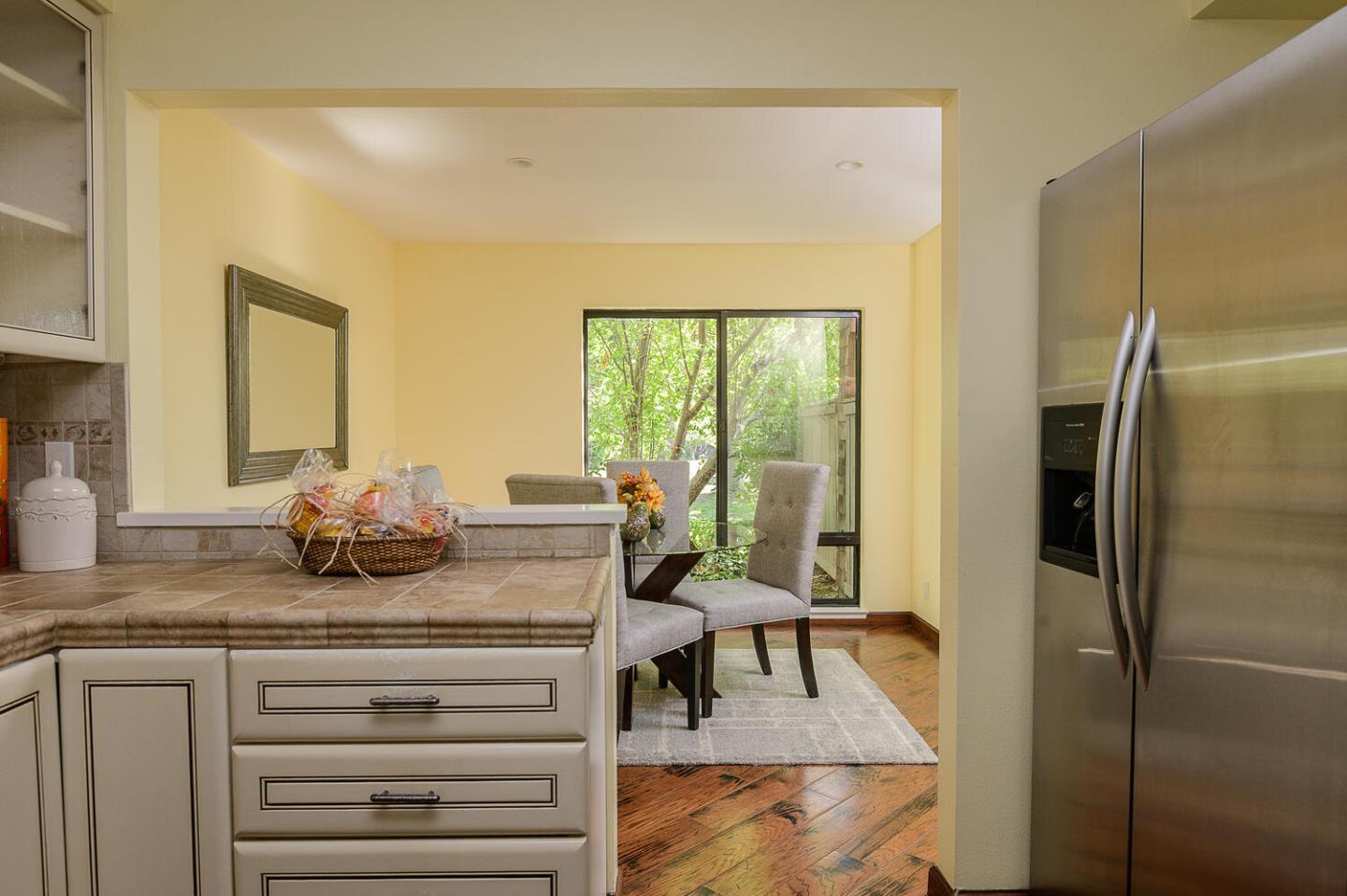 137 Peter Coutts Circle Stanford, CA 94305 - Photo 7 of 28 a kitchen with a table chairs refrigerator and cabinets