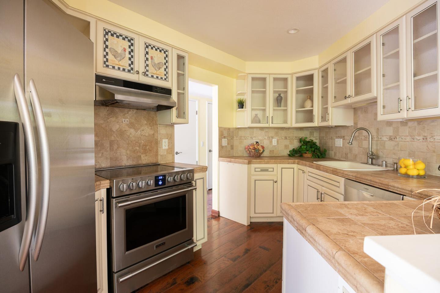 137 Peter Coutts Circle Stanford, CA 94305 - Photo 8 of 28 a kitchen with stainless steel appliances granite countertop a stove and a refrigerator