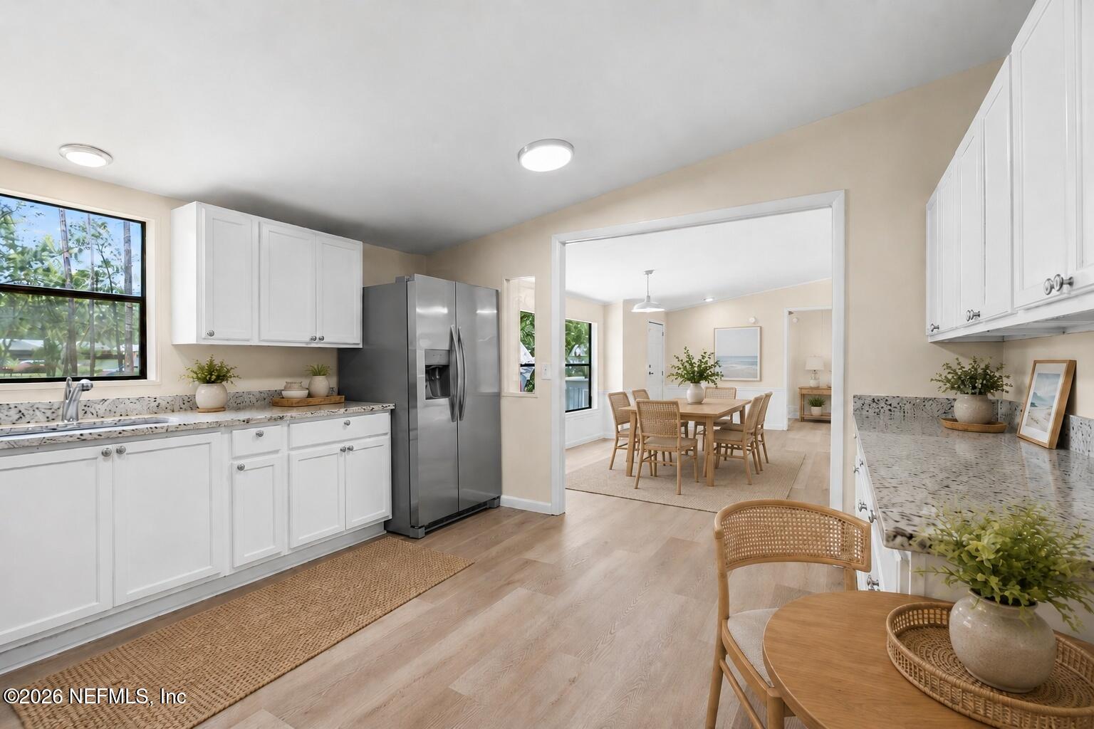 85110 Theresa Road Yulee, FL 32097 - Photo 6 of 43 06_Staged_Kitchen_with_Dining