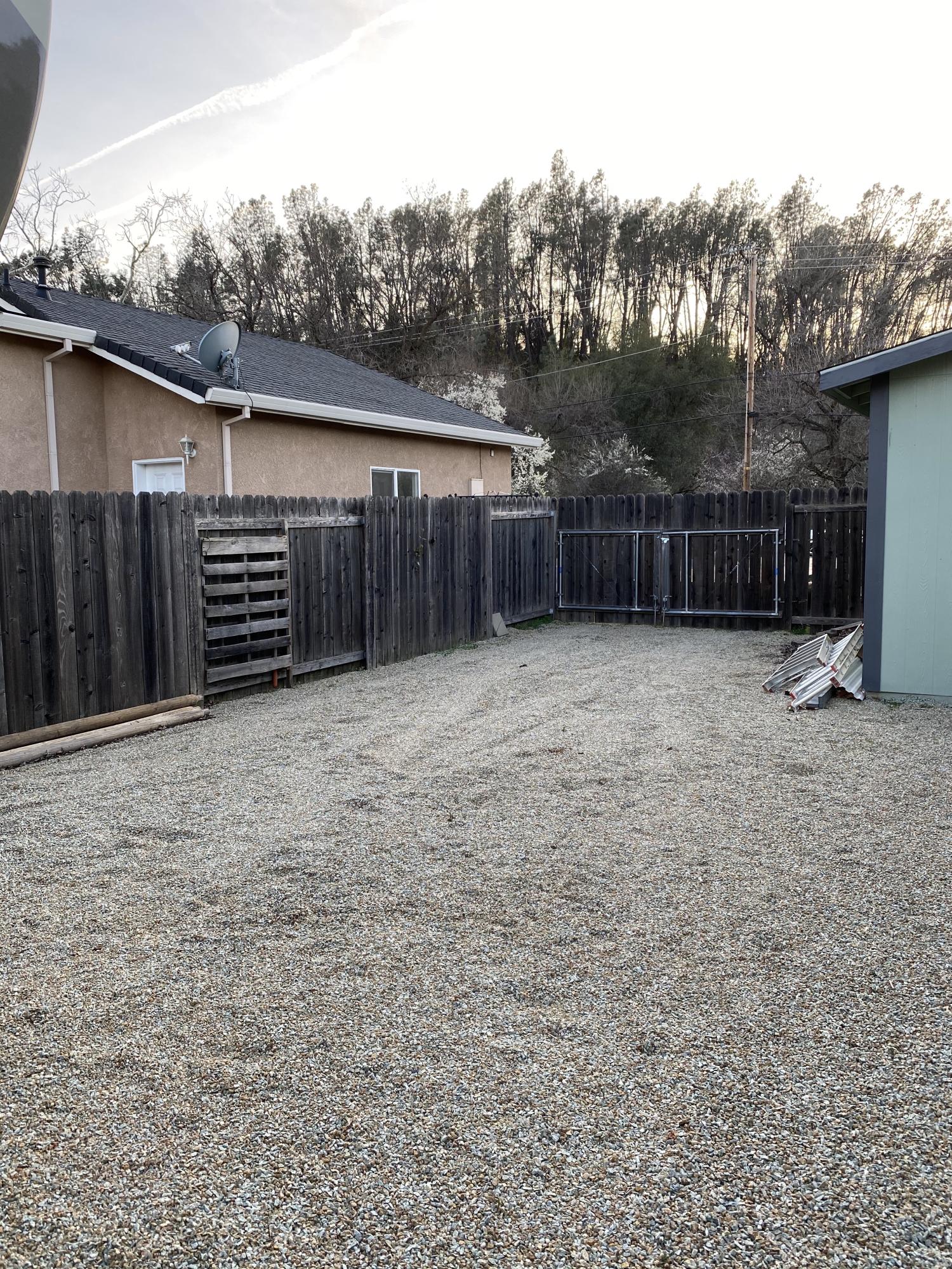 4935 Cedars Road Redding, CA 96001 - Photo 14 of 18 a view of a backyard of the house